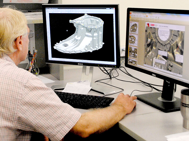 Die designer showing a 3-D model of a product for high pressure die casting